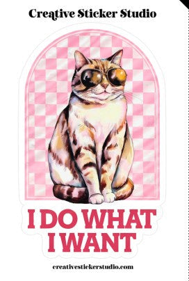 Sticker with a cat design and text 'I Do What I Want' on a pink checkered background, brand 'Creative Sticker Studio' visible.