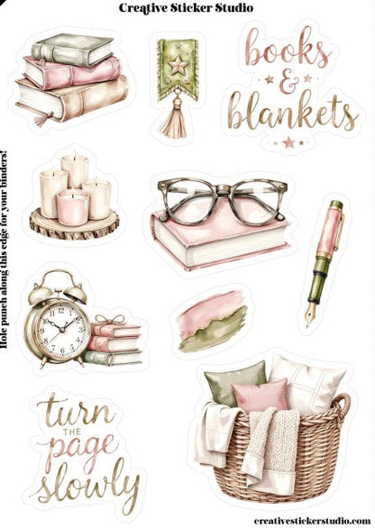 Collection of books, blankets, candles, glasses, alarm clock, pen, and basket with decorative text on a white background.