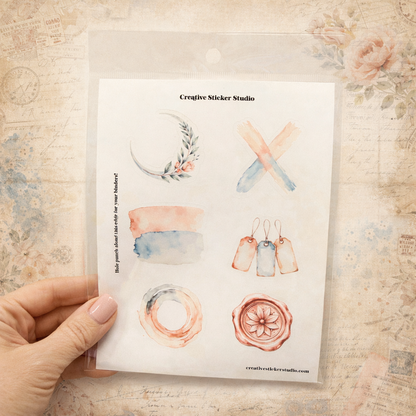 Hand holding a card with watercolor designs and 'Creative Sticker Studio' branding.