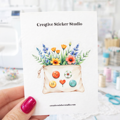 Sticker Card with a pouch of flowers and buttons held by a hand, branded 'Creative Sticker Studio'.