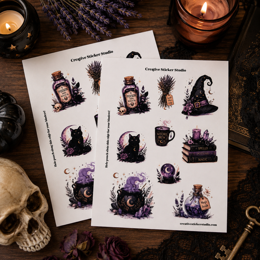 Two sheets of witch-themed sticker designs displayed on a dark wooden surface surrounded by Halloween decor, including a skull, candle, lavender, and key. The stickers feature a black cat, potion bottle, cauldron, witch hat, and spells on a white background.