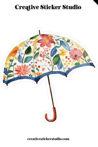 Decorative umbrella with floral design on a white background, featuring 'Creative Sticker Studio' branding.