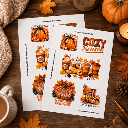 Two printed sticker sheets displayed on a rustic wooden surface with autumn props, featuring fall-themed illustrations such as pumpkins, leaves, coffee cups, and the text 'Cozy Season' and 'Creative Sticker Studio'.