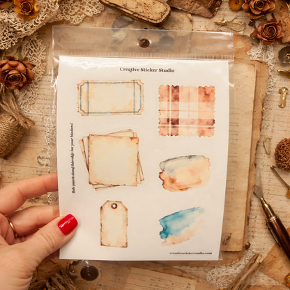 Packaging of Creative Sticker Studio with vintage-style stickers on a textured surface.